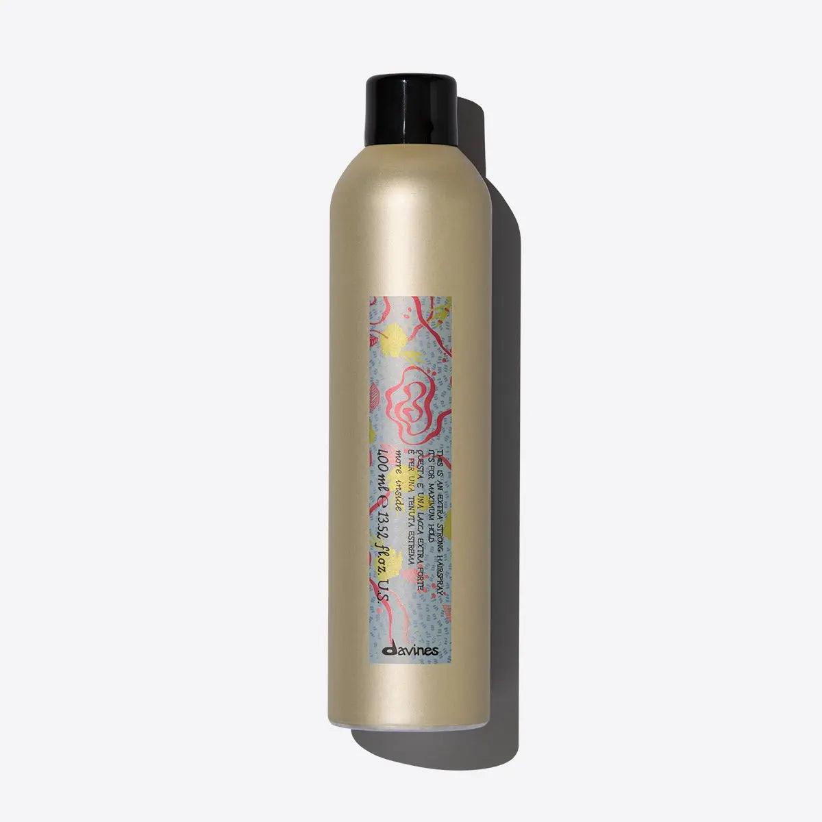 Extra strong hairspray bottle by Davines, designed for long-lasting hold without residue or stickiness.