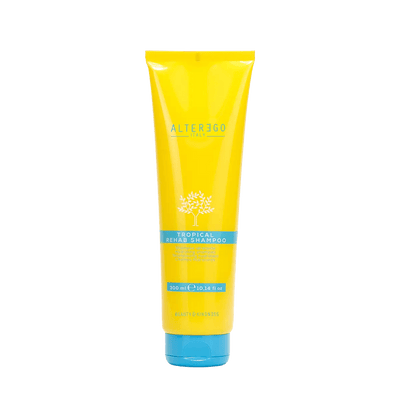 Tropical Rehab Shampoo by Alter Ego in a bright yellow tube, designed for gentle cleansing and hydration after sun exposure.