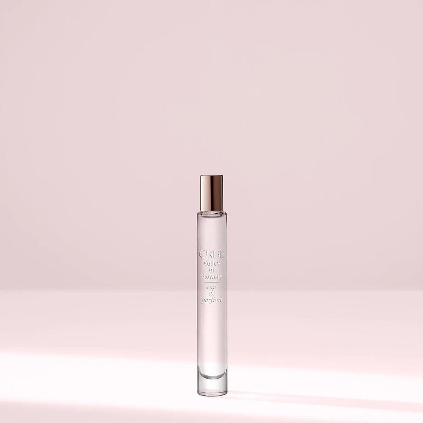 Valley of Flowers Eau De Parfum travel size bottle on a soft pastel background.