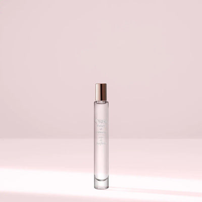 Valley of Flowers Eau De Parfum travel size bottle on a soft pastel background.