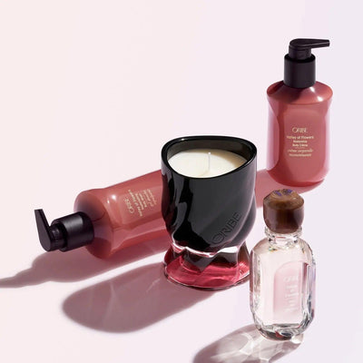 ORIBE Valley of Flowers body wash, candle, and fragrance showcasing luxurious skincare and relaxation products.